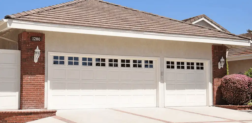 Residential garage door repair service for a double garage door in Aurora, CO