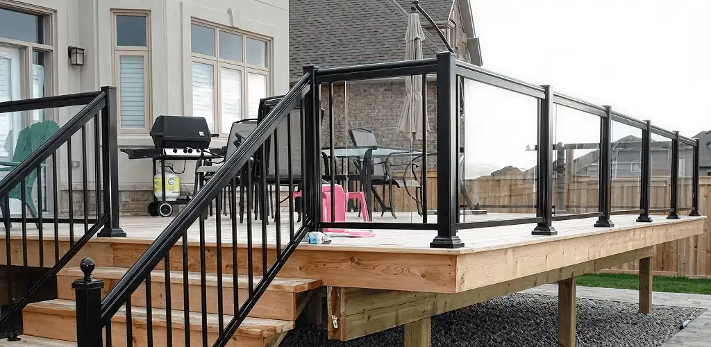 Handrail installation on a deck staircase for safety and code compliance in Aurora, CO